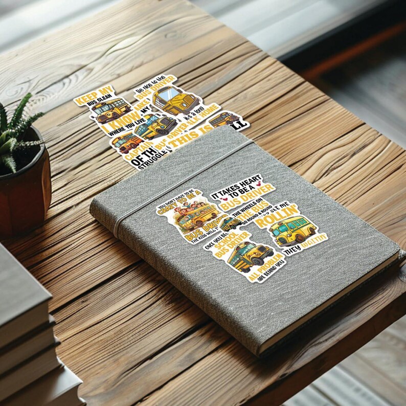 May include: A set of eight yellow school bus stickers with various sayings about being a bus driver. The sayings include "Keep my bus clean", "You don't have to be crazy to be a bus driver", "It takes heart to be a bus driver", "The wheels on the bus go round and round", "Once you've been a school bus driver", "All problems get solved when you're rolling", and "They don't get it".