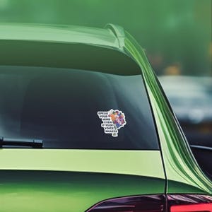 May include: A car window sticker with a floral design and the text "Speak your mind even if your voice shakes."