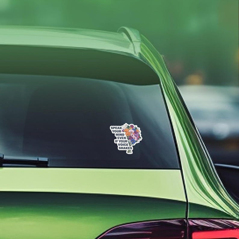 May include: A car window sticker with a floral design and the text "Speak your mind even if your voice shakes."