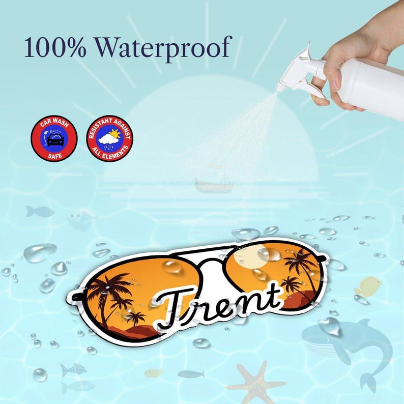 May include: A personalized sunglasses sticker with the name "Trent" in white script. The lenses feature a sunset scene with palm trees. The sticker is labeled "100% Waterproof" and "Car Wash Safe."