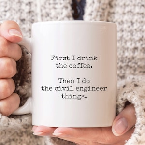 May include: White ceramic mug with black text that reads "First I drink the coffee. Then I do the civil engineer things."