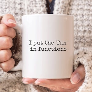 May include: White ceramic coffee mug with the text "I put the 'fun' in functions" printed in black.