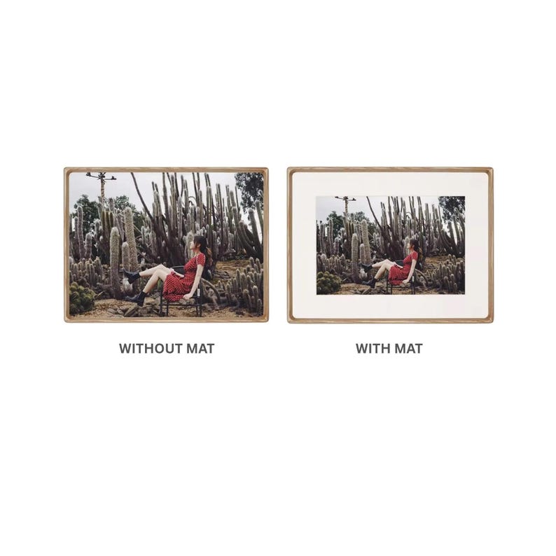 Side-by-side comparison of the same landscape photograph displayed without a mat and with a wide white mat in a light wood picture frame.