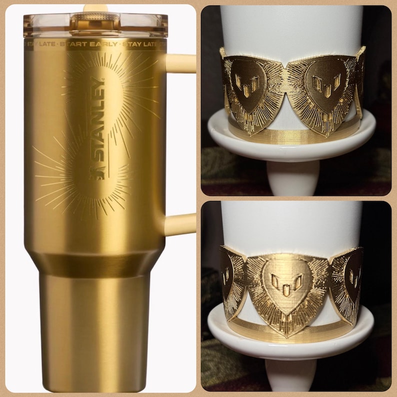 May include: A gold-colored Stanley travel mug with a handle and a clear lid. The mug has the Stanley logo and the text "START EARLY - STAY LATE". Also shown are gold-colored decorative bands around a white mug.