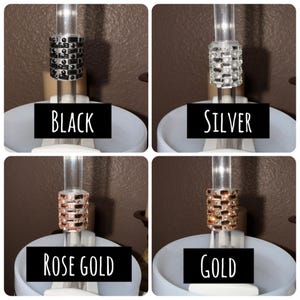 May include: Four decorative air freshener vent clip designs in black, silver, rose gold, and gold. Each clip features a rectangular design with a band of small, decorative elements. The text "BLACK", "SILVER", "ROSE GOLD", and "GOLD" are displayed below each clip.