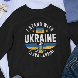 A sweatshirt mockup, showing a black shirt, with the Ukraine Eagle design on the front.