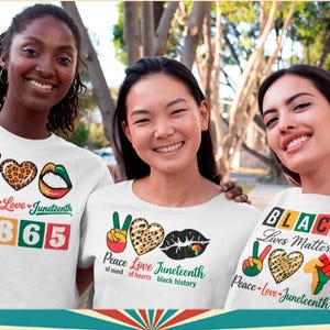 May include: Three people wearing white t-shirts with Juneteenth-themed graphics. The shirts feature peace signs, leopard print hearts, and the text "Peace Love Juneteenth." One shirt displays "1865," and another says "Black Lives Matter."