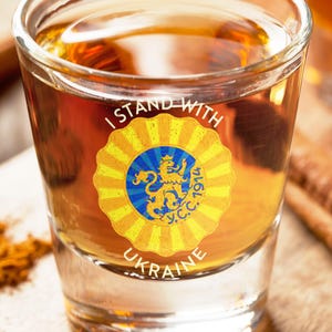 A mockup of the Ukrainian Sich design on a shot glass.