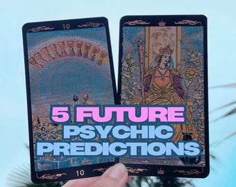 May include: Two tarot cards with black borders are held up against a blue sky. The cards feature colorful illustrations and the text "5 FUTURE PSYCHIC PREDICTIONS". One card shows a woman in a crown, the other shows a series of cups.