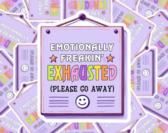May include: A purple sign with rounded corners and a rope hanger reads "Emotionally Freakin' Exhausted (Please Go Away)" in colorful letters with stars. A smiling face is drawn below the text.