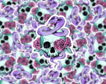 May include: A sticker featuring a teal skull adorned with pink roses and a purple cobra coiled around it. The background is a repeating pattern of similar skulls, roses, and snakes, creating a gothic and floral design.
