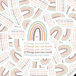 May include: A selection of stickers with a rainbow design in pastel shades. The stickers display the text: "5 Things you can see, 4 Things you can touch, 3 Things you can hear, 2 Things you can smell, 1 Thing you can taste."