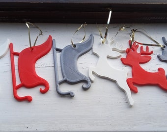 3D Printed Christmas Tree Decorations in the shape of a reindeer and sleigh