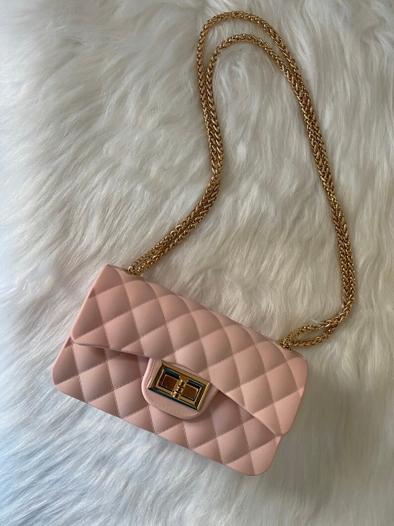 pink purse with gold chain