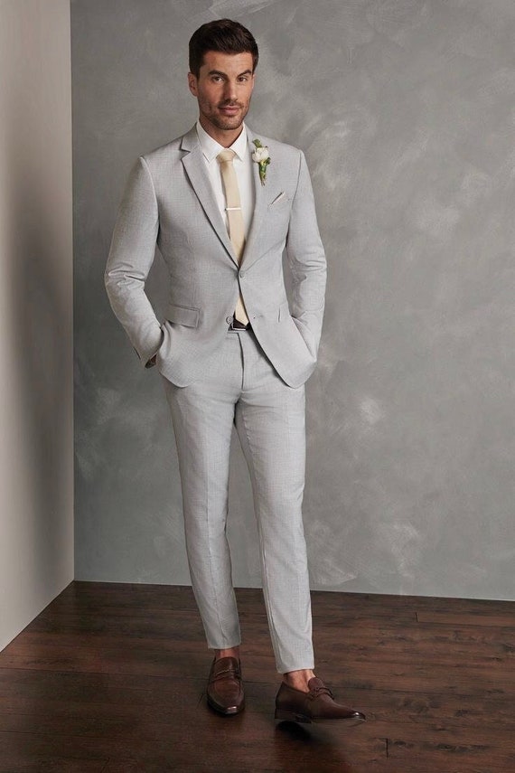 grey suit with ivory tie