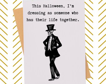 May include: A Halloween greeting card with a skeleton illustration wearing a tuxedo and top hat. The card reads, "This Halloween, I'm dressing as someone who has their life together."