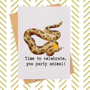 May include: Greeting card featuring a whimsical illustration of a snake wearing a party hat. The snake is brown with darker spots. The card reads "Time to celebrate, you party animal!" on a white background.