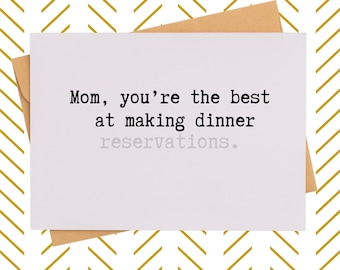 May include: A white greeting card with the text "Mom, you're the best at making dinner reservations." is placed on a brown envelope. The background features a gold and white chevron pattern.