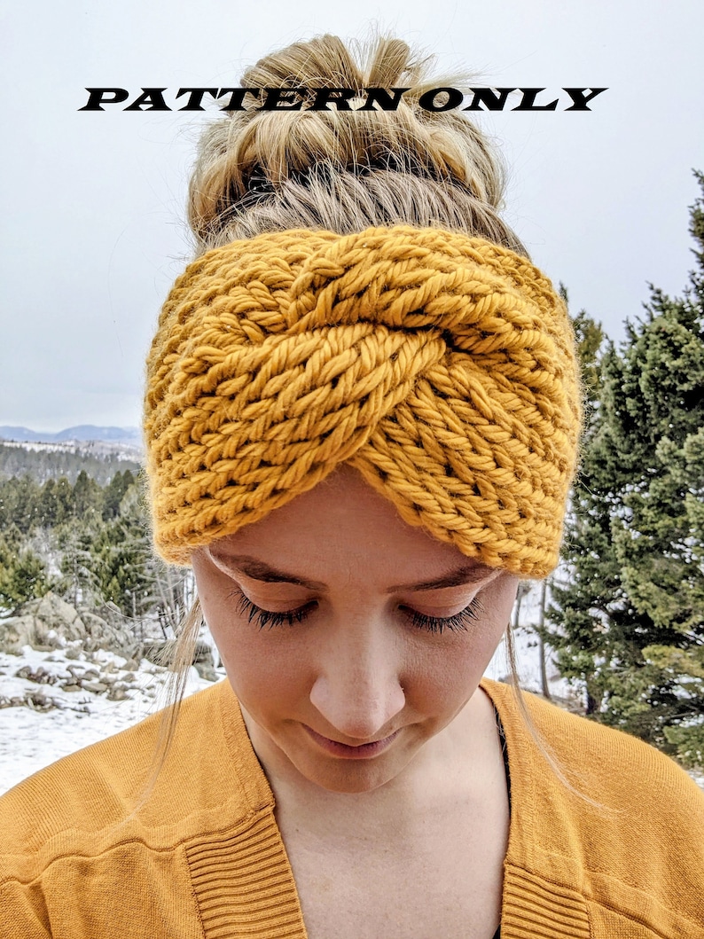 May include: A mustard yellow knitted headband with a twisted design. The headband is worn by a person with blonde hair.