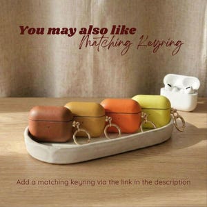 Leather AirPods case paired with a matching leather keyring, creating a coordinated and stylish accessory set, Optional Keyring Add-On
