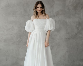 Wedding dress with puff sleeves. Lightweight organza fabric. Long train. Gia style.