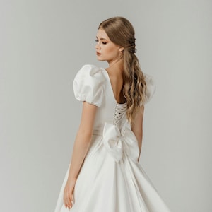 Lush wedding dress with a bow. Ivory matte satin dress. fluffy short sleeve. Long train. Wedding dress with bow in back. Carrie  style