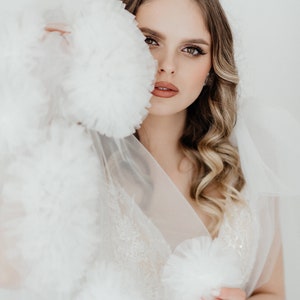 Veil. Long veil with lush tulle flowers.