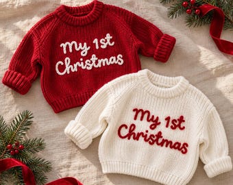 Handgeborduurde babytrui met de tekst "Mijn eerste kerst"