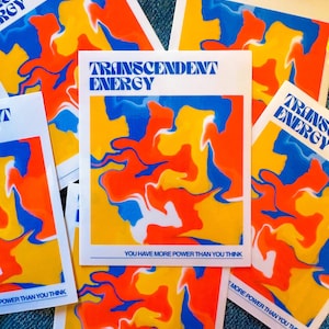 May include: Four stickers with a colorful abstract design in shades of yellow, orange, blue, and white. The stickers have the text "TRANSCENDENT ENERGY" and "YOU HAVE MORE POWER THAN YOU THINK" printed on them.