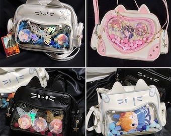 May include: Four different cat-shaped clear plastic purses with a variety of decorations. The purses are silver, pink, black, and white. The purses have a clear plastic window on the front that shows the inside of the purse. The purses have a variety of decorations, including stars, hearts, and butterflies.