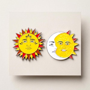 May include: A set of three ceramic mugs with a speckled, matte finish. The mugs are in shades of cream, light gray, and dark gray. Each mug has a simple, modern design and a rounded handle.