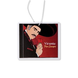 May include: A white car air freshener with a red background and a black and white illustration of Vicente Fernandez holding a red rose. The text "Vicente Para Siempre" is printed in gold on the air freshener.