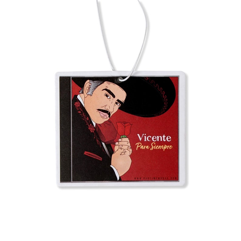 May include: A red and black car air freshener with a cartoon image of Vicente Fernandez holding a red rose. The text "Vicente Para Siempre" is printed in yellow on the air freshener.