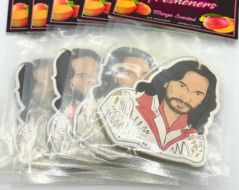May include: A collection of air fresheners featuring a cartoon image of a man with long hair and a beard. The packaging includes the text "Old School Freshners" and "Mango Scented". The air fresheners are in a clear plastic bag.