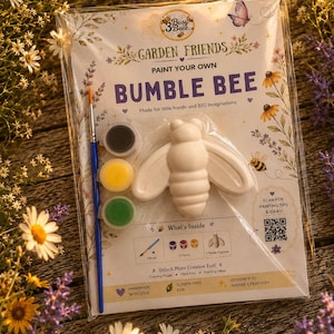 May include: A paint your own bumble bee kit in clear plastic packaging. The kit includes a white plaster bee figurine, a blue paintbrush, and three small paint pots in black, yellow, and green. The packaging features the text Garden Friends.