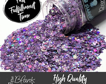 May include: A jar of purple glitter with iridescent accents. The jar is labeled "The Blank Pineapple Purple Glitter".
