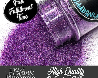 May include: A clear plastic bottle of purple glitter is tipped over, spilling onto a white surface. The glitter is a vibrant, sparkling purple. The bottle has a black label with a pineapple design. Text on the image reads "Fast Fulfillment Time" and "High Quality Polyester Glitter."
