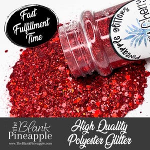 May include: A jar of red glitter with a white label that says "The Blank Pineapple Glitter". The glitter is spilling out of the jar onto a white surface.