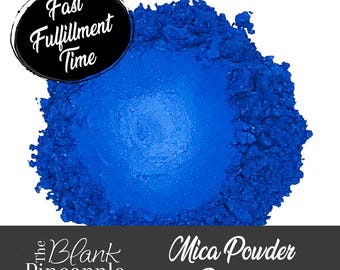 May include: A close-up of a bright blue mica powder pigment. The powder is in a pile and has a metallic sheen. The text "Mica Powder Pigment" is visible below the pile of powder.