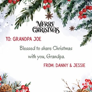 May include: A Christmas card with a watercolor design featuring evergreen branches, red berries, and pine cones. The card reads "Merry Christmas" and includes a personalized message "To: Grandpa Joe" and "From: Danny & Jessie."