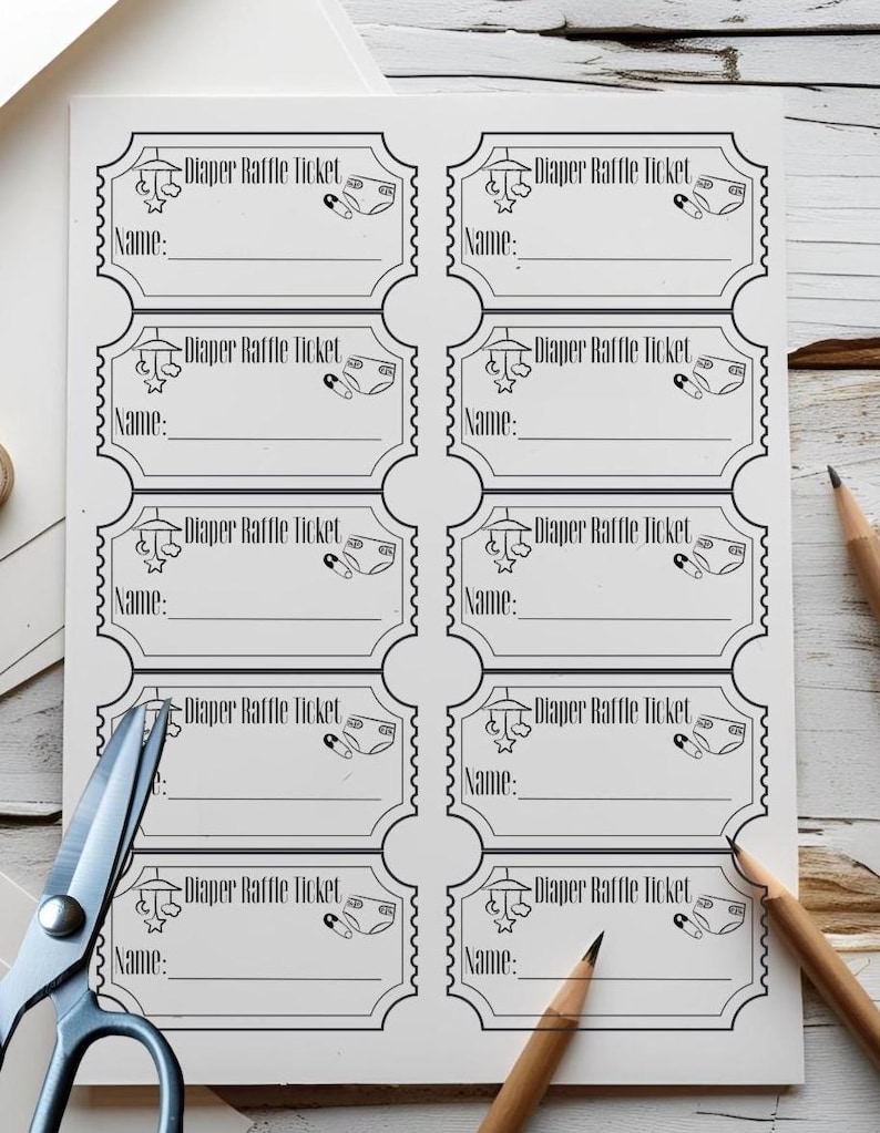 May include: A white sheet of paper with eight "Diaper Raffle Ticket" templates printed in black ink. Each ticket has a space for a name and a small diaper graphic. Scissors and pencils are in the image.