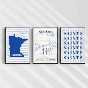 May include: Three framed prints with blue and white designs. One features the state of Minnesota, another a guest check with handwritten text, and the third repeats the word "SAINTS" vertically.