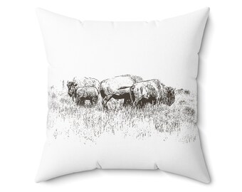 May include: White square throw pillow featuring a sepia-toned illustration of a small herd of bison grazing in a grassy field. The pillow has a soft, textured appearance, suitable for home decor.