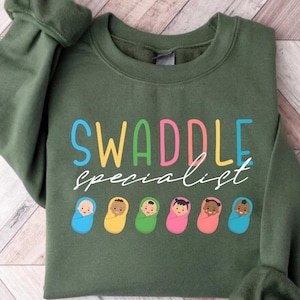 Retro Funny Swaddle Specialist Labor and Delivery NICU Baby Nurse L&D Nurse Graphic TShirt for Women