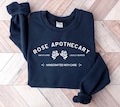 Retro Funny Rose Apothecary Rosebud Motel Handcrafted with Care Moira Rose David Rose Schitt Creek Graphic TShirt for Women