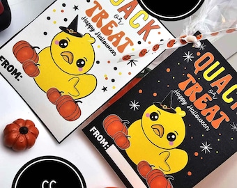 May include: Two printable Halloween treat bag tags featuring a yellow duck wearing a witch hat and surrounded by orange pumpkins. The text on the tags reads "Quack or Treat" and "Happy Halloween".