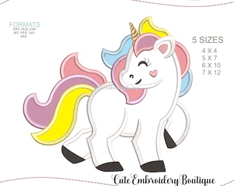 May include: Embroidery design of a white unicorn with a pink, yellow, and blue mane and tail. The unicorn has a pink heart on its cheek and is standing on all fours. The design is available in five sizes: 4x4, 5x7, 6x10, and 7x12 inches.