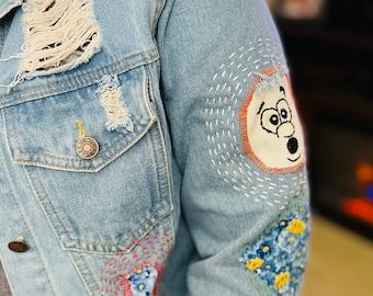 Hand embroidered patchwork jean jacket.