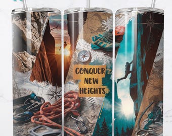 May include: A stainless steel tumbler with a colorful design featuring a mountain climber, rope, compass, and the text "CONQUER NEW HEIGHTS".