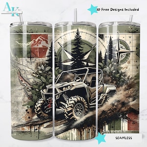 May include: A stainless steel tumbler with a wrap-around design featuring an off-road vehicle, compass, and mountain scene. The design includes the text "10 Free Designs Included" and "Seamless". The tumbler has a straw.